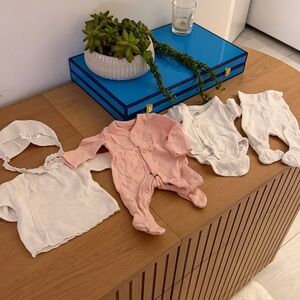 Newborn girls M&S pink onsie, H&M white top and pants, Lilette hat and sweater